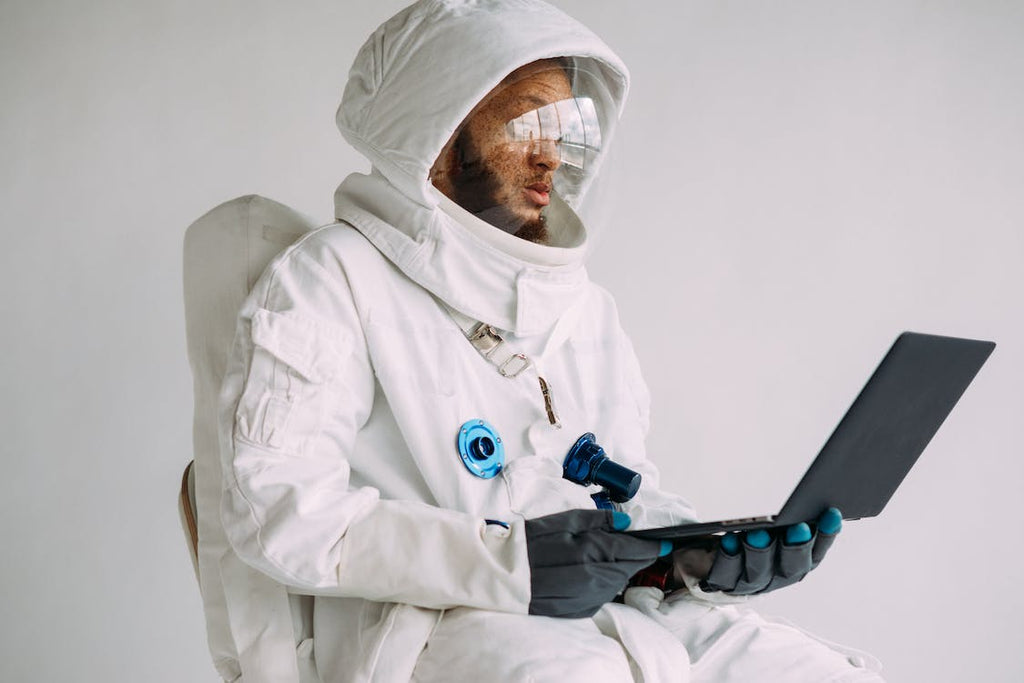 Guy in Space Suit With A Laptop Froom BornGood